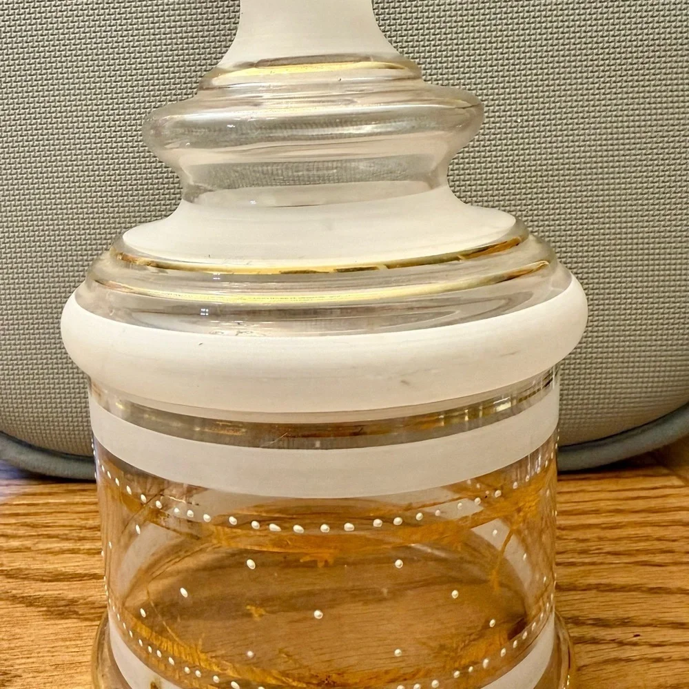 Elegant mid-century clear and frosted glass jar with gold accents.